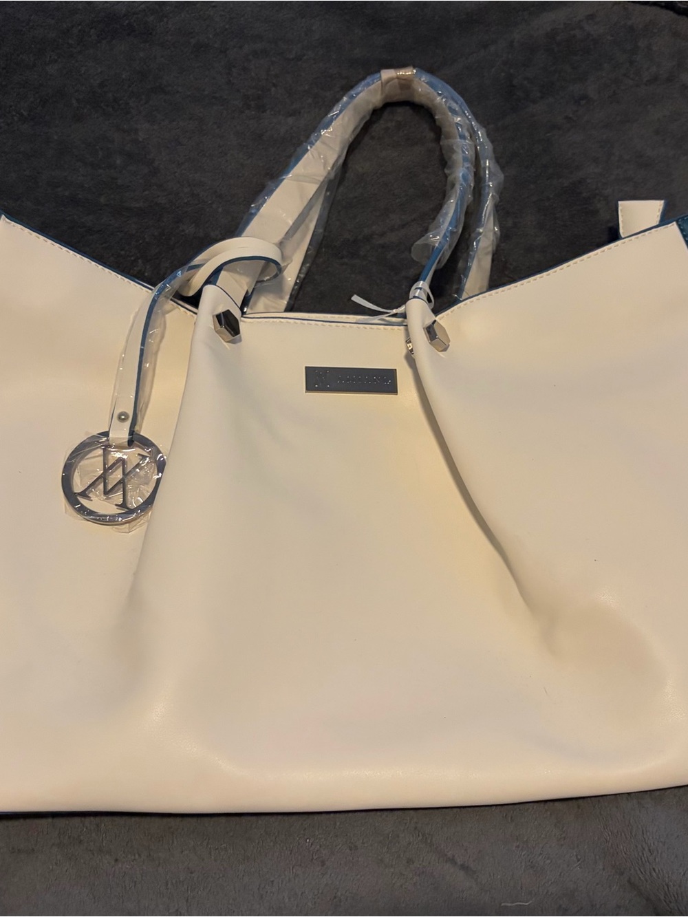 Chic Cream Tote with Silver Accent Charm